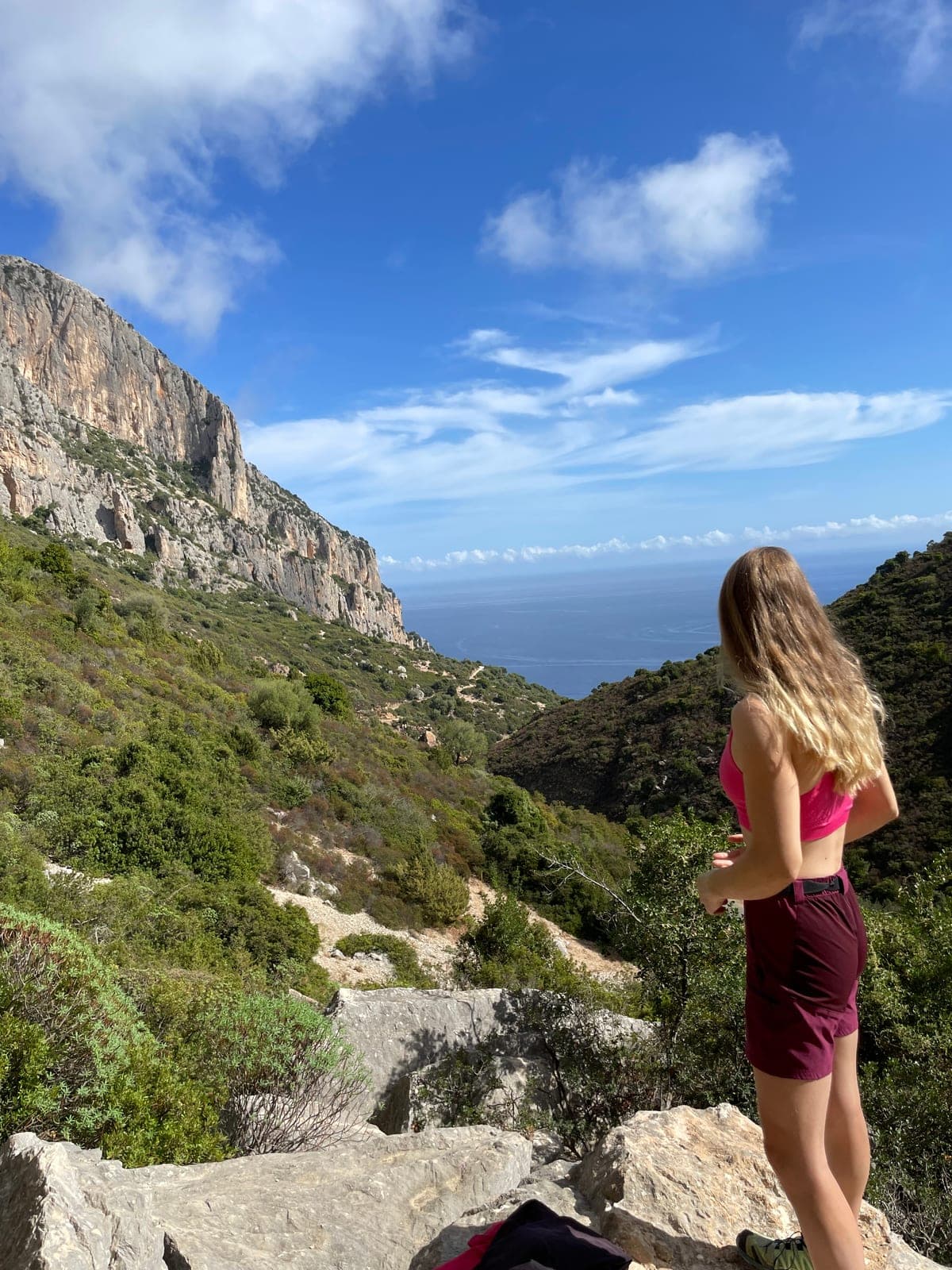 Urška looking out over cliffs and the sea