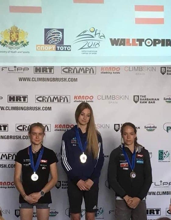 Urška with her medal on a national podium