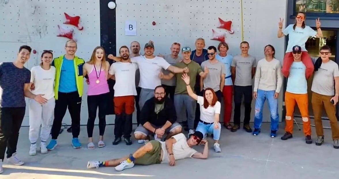 Urška with the climbing team in front of the gym