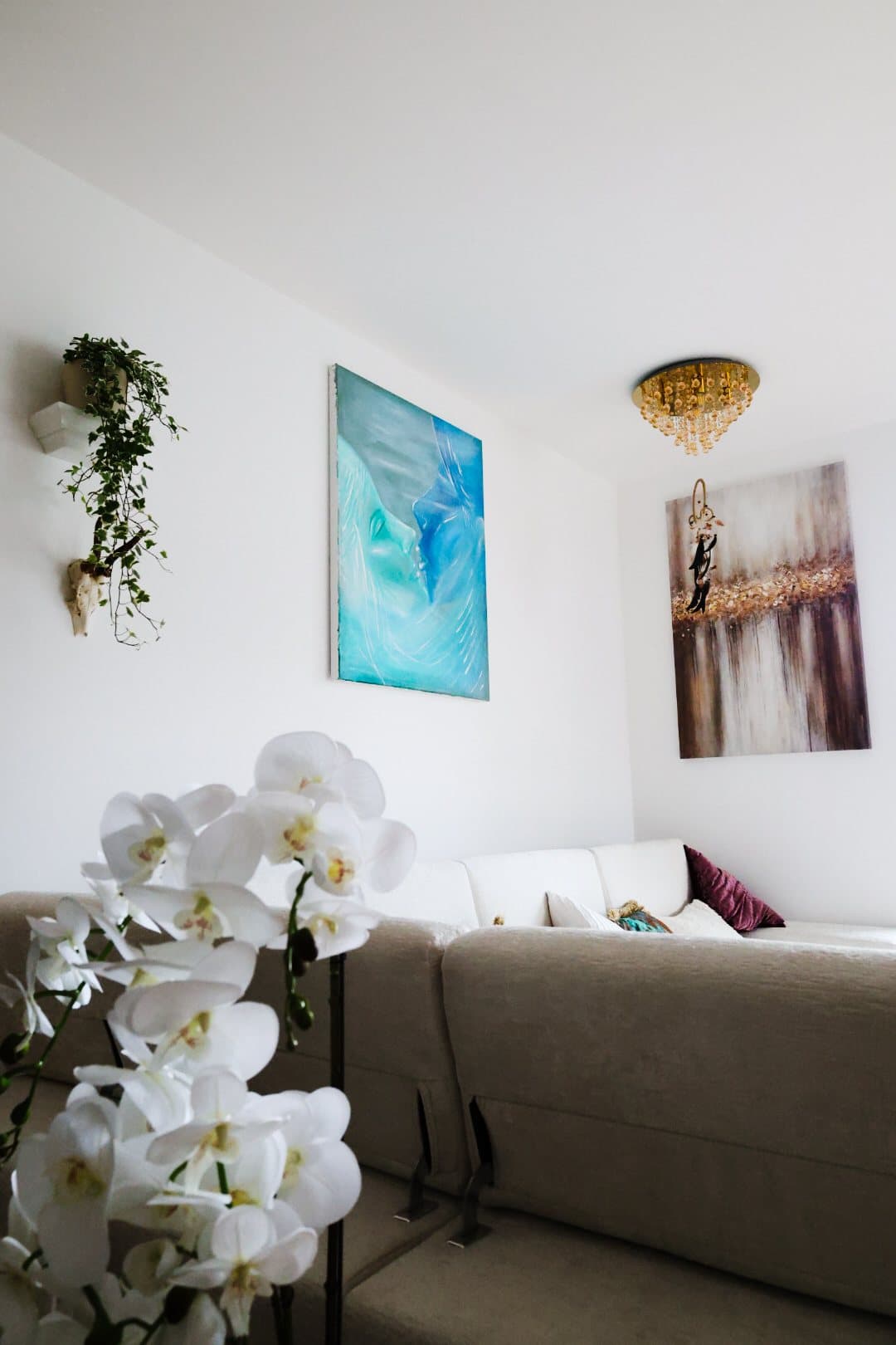 The living room seen past a white orchid