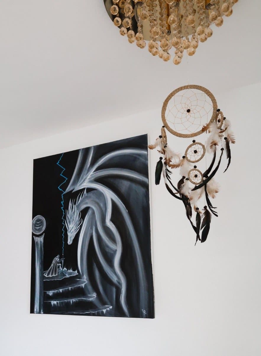"The Prophecy" below a beaded ceiling light