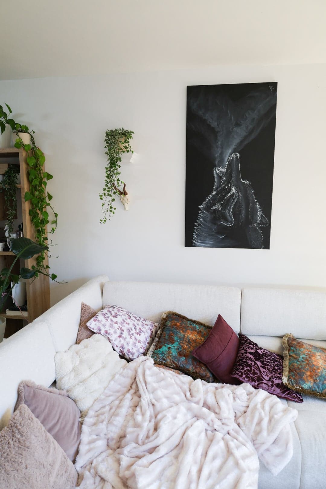 'Voice of the Night' above a white sofa
