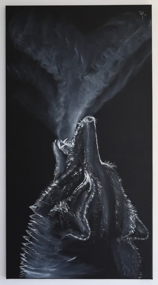 Photograph of an original black-and-white painting by Urška of a wolf howling upward, its breath rising into the dark like white smoke.