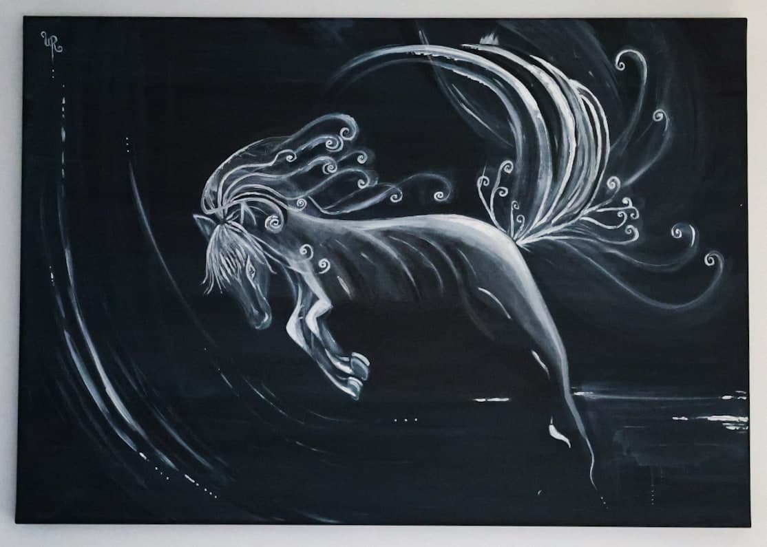 Photograph of an original black-and-white painting by Urška of a white horse leaping across a dark canvas, its mane and tail curling into flowing lines of light.